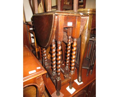Small 1930's oak oval drop-leaf gate leg table on barley twist supports 