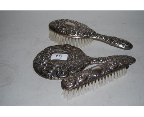 Sterling silver floral and mask head embossed three piece dressing table set including mirror 