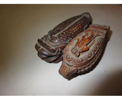 19th Century carved vegetable ivory snuff box in the form of a galleon together with a Far Eastern carved hardwood figure of 