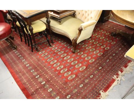 Pakistan Bokara pattern carpet on red ground 
