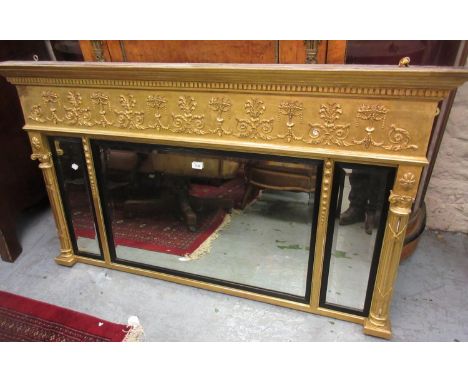 Regency gilded composition triple plate overmantel mirror, the moulded dentil cornice above a fruit, swag and acanthus relief