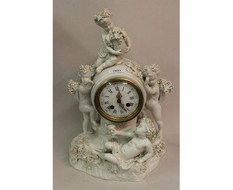 19th Century Meissen blanc de chine mantel clock mounted with figures of cherubs with grapes and a wine goblet, the circular 