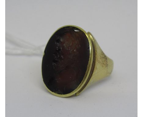 14ct Gold signet ring inset with an antique glass intaglio portrait 