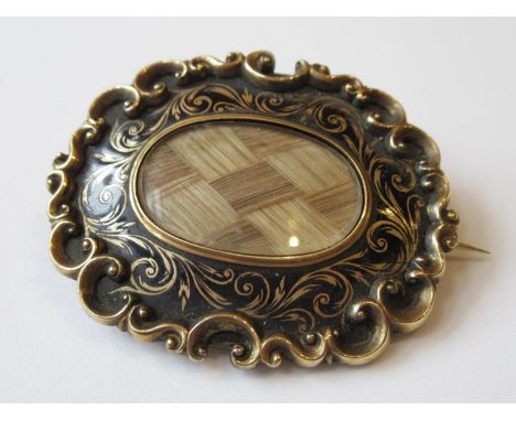 Victorian oval gold enamel decorated and hair inset memorial brooch 