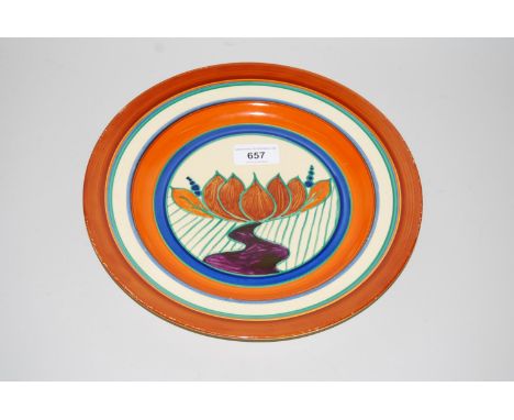 Clarice Cliff Fantasque plate decorated with stylised flowering lotus, 10.5ins diameterSome crazing and loss of paint - other