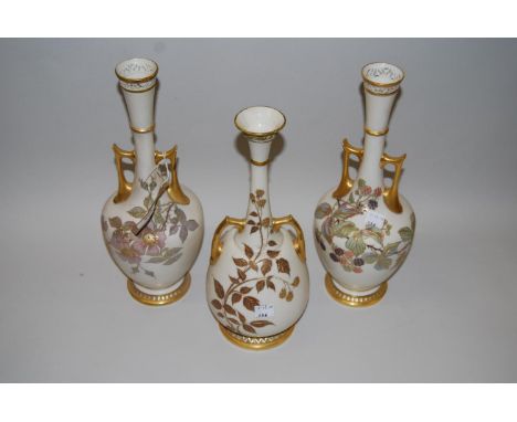 Pair of Worcester ivory ground narrow neck vases painted with fruits and flowers, 12.5ins high (damages and restorations), to