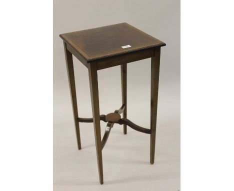 Edwardian mahogany and satinwood crossbanded square top occasional table together with a small mahogany mantel clock (at faul
