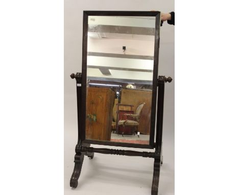 William IV mahogany rectangular swing frame cheval mirror, the moulded uprights above baluster turned stretchers and scroll f