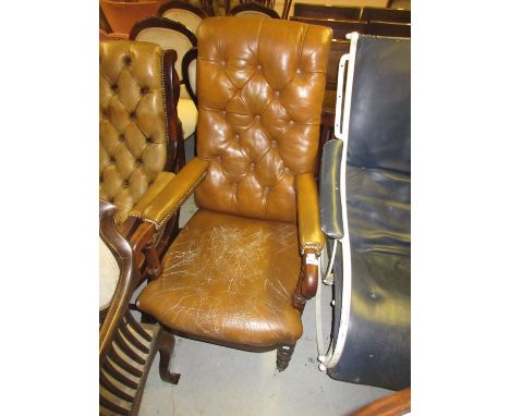 19th Century  mahogany and button leather upholstered open armchair, raised on turned tapering front supports with brass and 