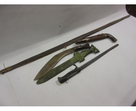 Antuique Kukri (minus scabbard), copy of a Roman dagger, wooden cased knife and fork together with an excavated bayonet and a