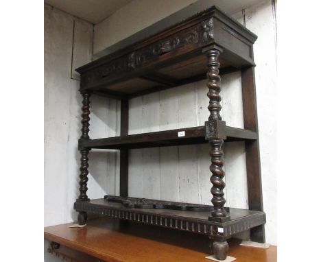 Late 19th Century oak three tier buffet having galleried back above two frieze drawers with mask head carved handles and two 
