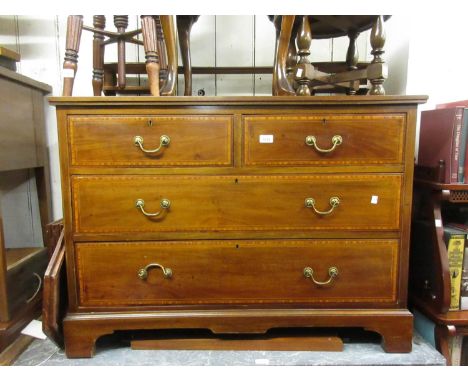 Edwardian mahogany and satinwood crossbanded dressing table, the shaped swing mirror above a pair of jewel drawers, the base 