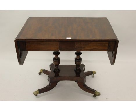 Regency mahogany drop-leaf sofa table with two frieze drawers, raised on baluster turned supports with quadruped base having 