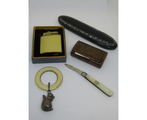 Small silver bladed mother of pearl fruit knife, silver babies rattle teether in the form of a squirrel, a cigarette lighter,