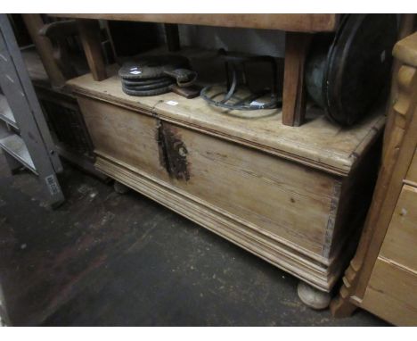 19th Century Continental stripped trunk with hinged cover above an iron lock plate and bun feetOverall in ok condition. Has b