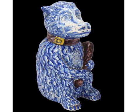 Portuguese blue and white faience figural bear container with club, height 25cm Lid has 2 short hairline cracks running from 