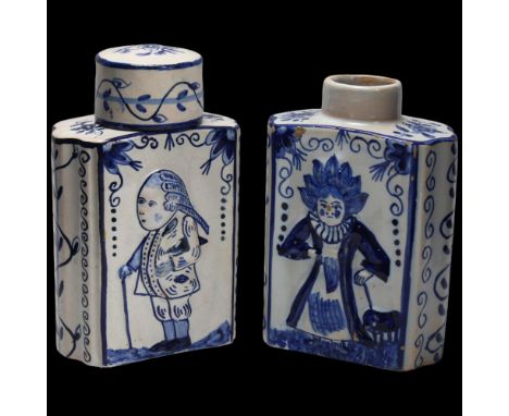 Pair of Delft blue and white pottery tea caddies, with relief moulded figures (1 lid missing), 12.5cm Lid has some profession