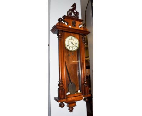 A Vienna type double weight driven wall clock, circa 1890.  Case with minor scratches and minor chips in parts, the dial is c