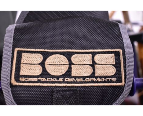 A Boss Tackle developments rod carry bag containing 2 Dunlop 3pc 11ft carp rods and rod rests