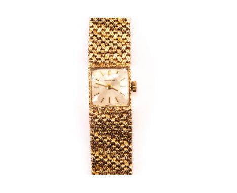 A 9ct gold Jean Renet lady’s wristwatch, with square case with baton numerals to dial, supported on a textured fine link brac