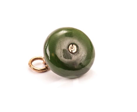 A cute hardstone charm, modelled as a curling stone with gold handle and ring 