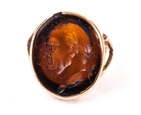 A 9ct gold and hardstone signet ring, the oval panel with intaglio bust of a Roman emporer or Napoleon 