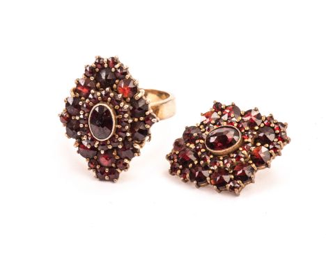 A garnet set ring and pendant, the diamond shaped cluster mounts, possibly from another piece of jewellery, now converted to 