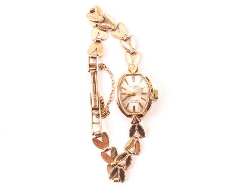 A 9ct gold Rotary lady’s wristwatch, having baton numerals on leaf design 9ct gold strap 