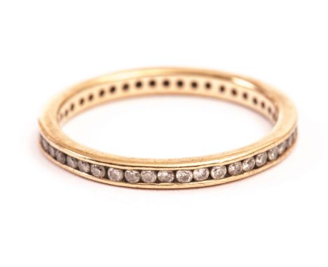 A 9ct gold and diamond full eternity ring, having channel set small brilliant cuts, approx size R 