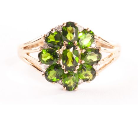 A 9ct gold and gem set ring, the cluster style tablet set with green diopside stones and diamonds 
