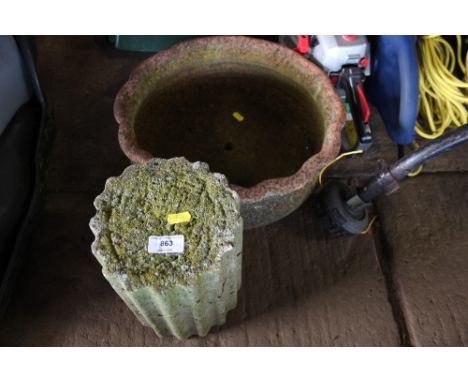 A terracota planter with concrete column