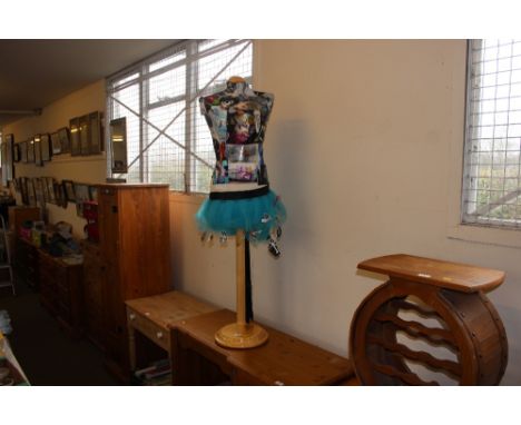 A mannequin on stand  