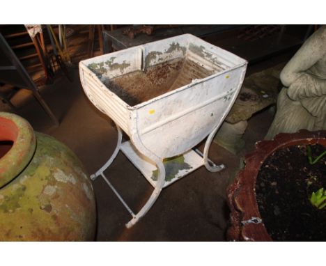 A white painted galvanised planter