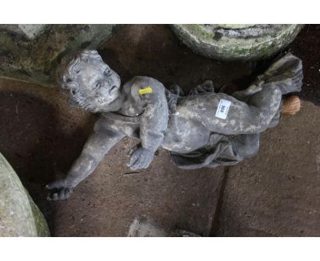 A concrete wall plaque in the form of a cherub