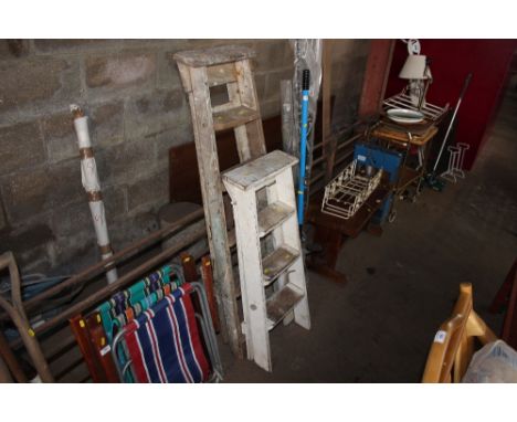 Two wooden step ladders