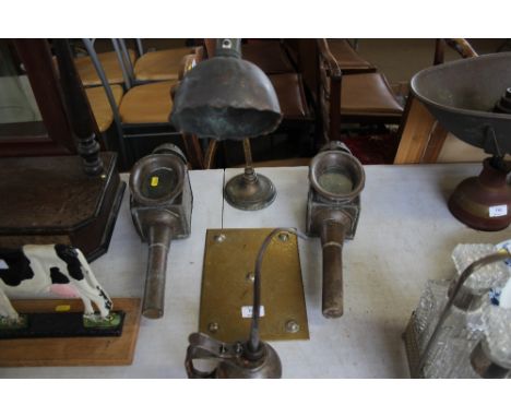 A pair of carriage lamps, brass plaque, lamp and oil can