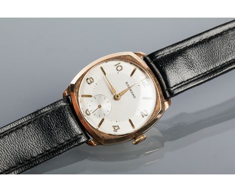 GENTLEMAN'S NINE CARAT GOLD CUSHION CASE GARRARD WRISTWATCH
the silvered dial with Roman numeral and baton hour markers, in a