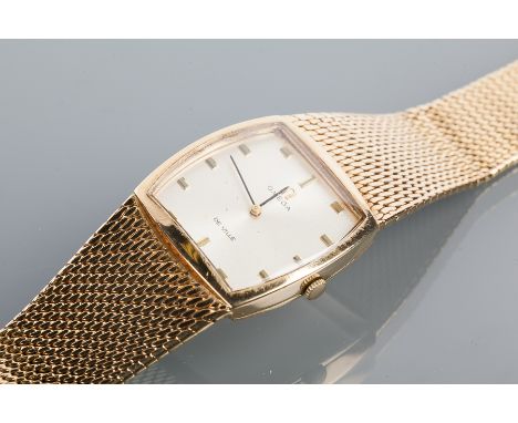 GENTLEMAN'S NINE CARAT GOLD OMEGA DE VILLE WRISTWATCH
the silvered dial with applied baton numerals, signed 620 cal. Omega mo