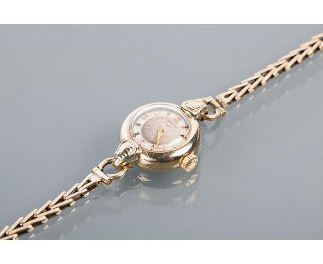 LADY'S EARLY TWENTIETH CENTURY NINE CARAT GOLD LONGINES COCKTAIL WATCH
the silvered dial with Arabic numerals at the quarter 