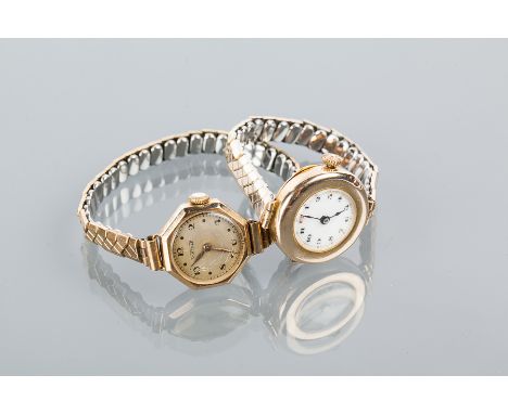 LADY'S EARLY TWENTIETH CENTURY NINE CARAT GOLD WRISTWATCH
the ceramic dial with arabic numerals and red twelve, on an expanda