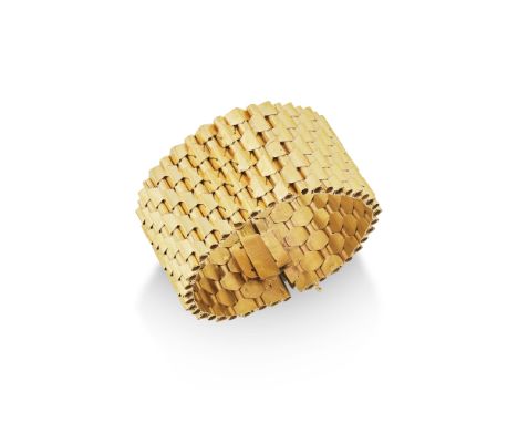 BRACELET ORFormant une succession de maillons articulés en or jaune, poinçon français d'import pour l'or 18K (750°)/00), dime