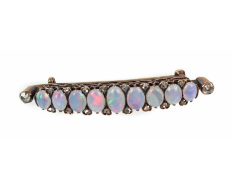 Opal Brosche mit Diamanten nicht punziert, fachmännisch geprüft, ca. 3,65 Gramm, leicht geschwungene Form von ca. 60 x 38 mm 