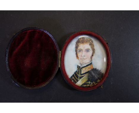 Miniature portrait, young Cavalry officer in blue and gold uniform, in hinged red leather case