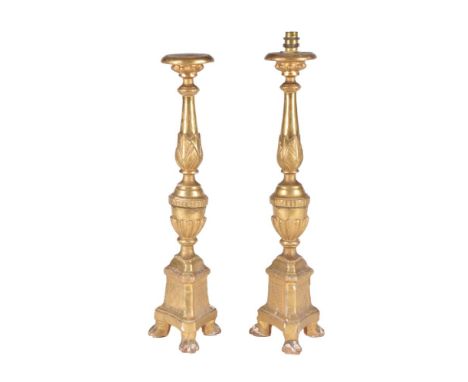 A pair of Italian turned and carved giltwood pricket altarsticks fitted as table lamps, 20th century, the lobed and foliate c