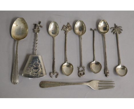 A Continental silver caddy spoon and eight other items.