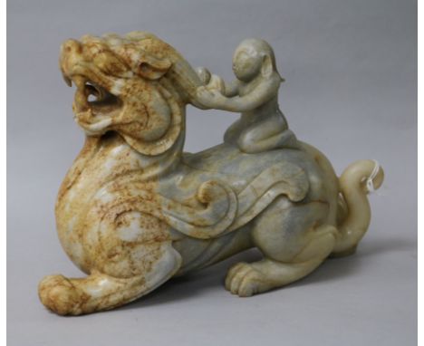 A large Chinese white and grey jade group of a lion-dog width 29cm height 14cm