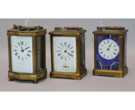 A French brass alarm carriage clock and two brass carriage timepieces (all a.f.), clock ringing on bell and having enamelled 