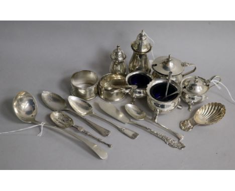 Two silver three-piece condiment sets with blue glass liners and sundry small silver, including a shell bowl caddy spoon, a G