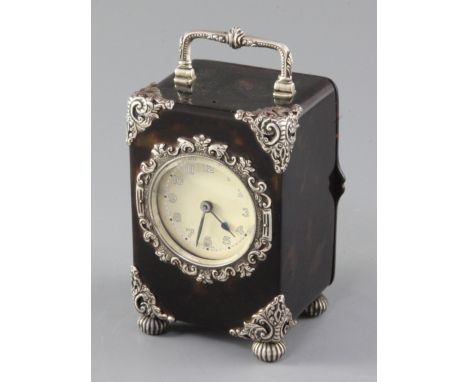 A George V silver mounted tortoiseshell carriage clock, with Arabic dial and repousse silver mounts, on fluted ball feet, HA 