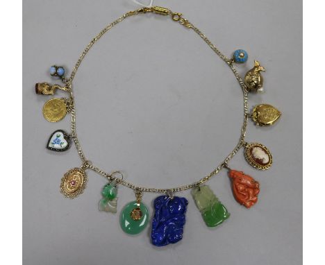 A white and yellow metal necklace (unmarked), hung with 14 various pendants and charms, including an 1887 half sovereign, a 9